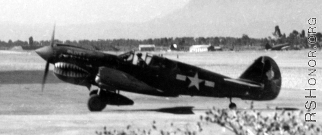 Close up of P-40 at Kunming. The nickname for the craft is almost visible on the nose cowling.