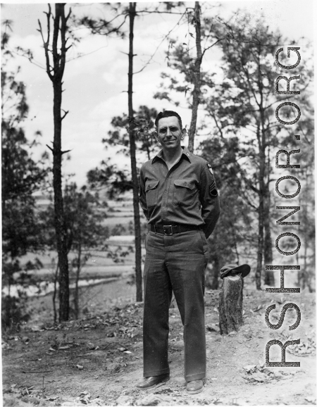 Eugene Wozniak poses among pines at Yangkai air base during WWII.