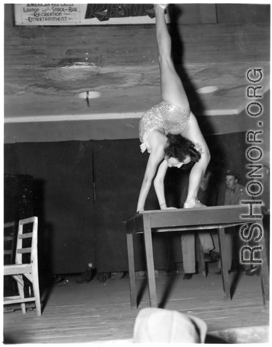 Celebrities visit and perform at Yangkai, Yunnan province, during WWII: Betty Yeaton performs contortionist act.