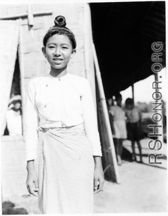 Local people in Burma near the 797th Engineer Forestry Company--a girl poses for the camera.  During WWII.