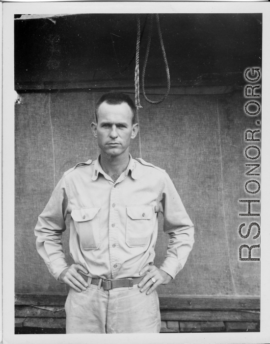 Engineer of the 797th Engineer Forestry Company poses before tent in Burma.  During WWII.