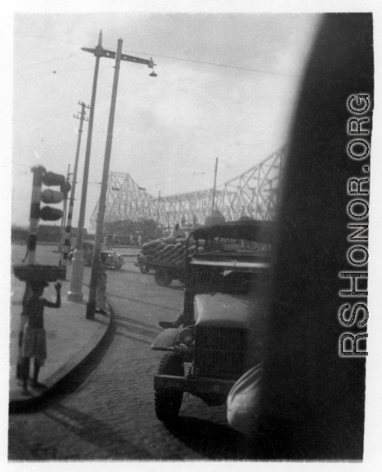 Howrah Bridge in Calcutta, India, as seen from transport truck, 2005th Ordnance Maintenance Company, 28th Air Depot Group, in India during WWII.