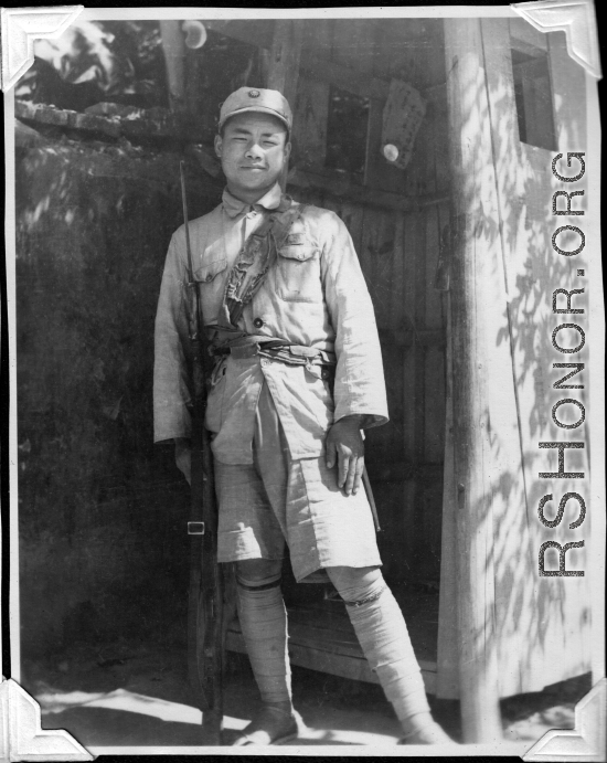 Chinese guard and guard shack, at Kunming, Yunnan, China. During WWII.