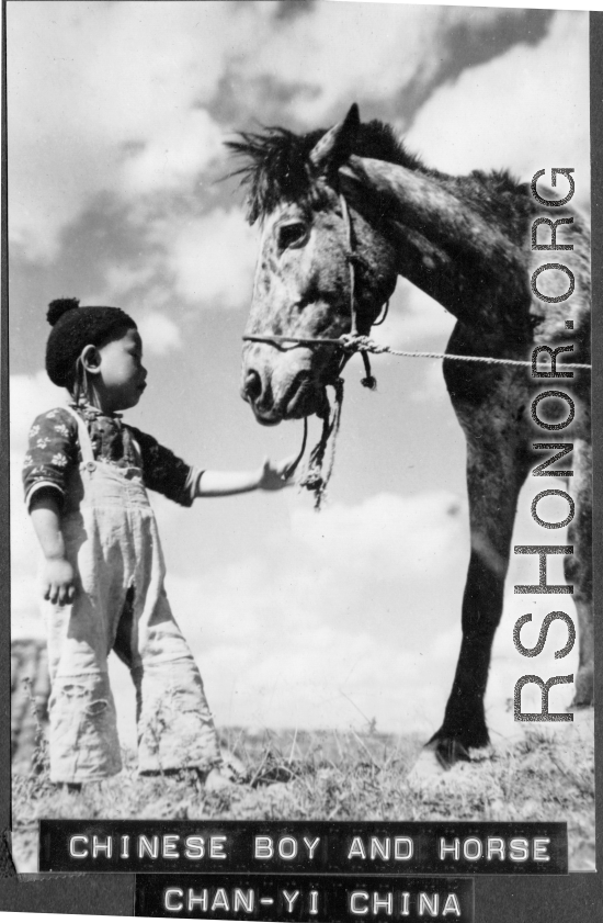 Chinese boy with horse at Chanyi (Zhanyi), during WWII.