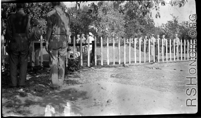 Solemn burial ceremony for American GIS who had died at a temporary war-time graveyard. In the CBI, during WWII.
