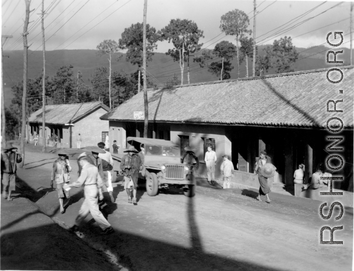 Offices and hostel area at Yangkai air base during WWII. Sign says, "Drive SLOW--Dust".