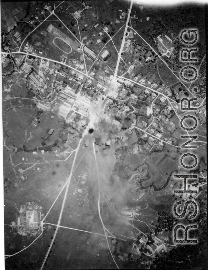 Bombing of small crossroads town, either in Burma or French Indochina. During WWII.