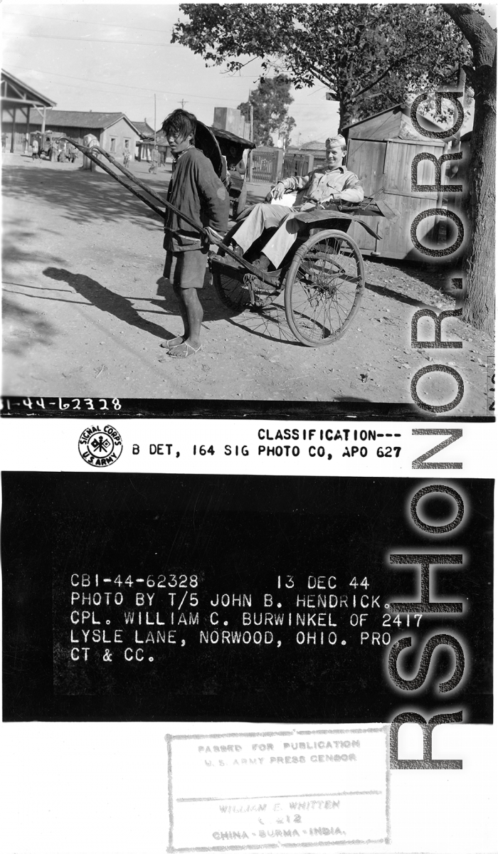 Rickshaw puller poses with his customer, Cpl. William C. Burwinkel.  Yunnan Province on December 13, 1944.  Photo by T/5 John B. Hendrick.  Passed by William E. Whitten.