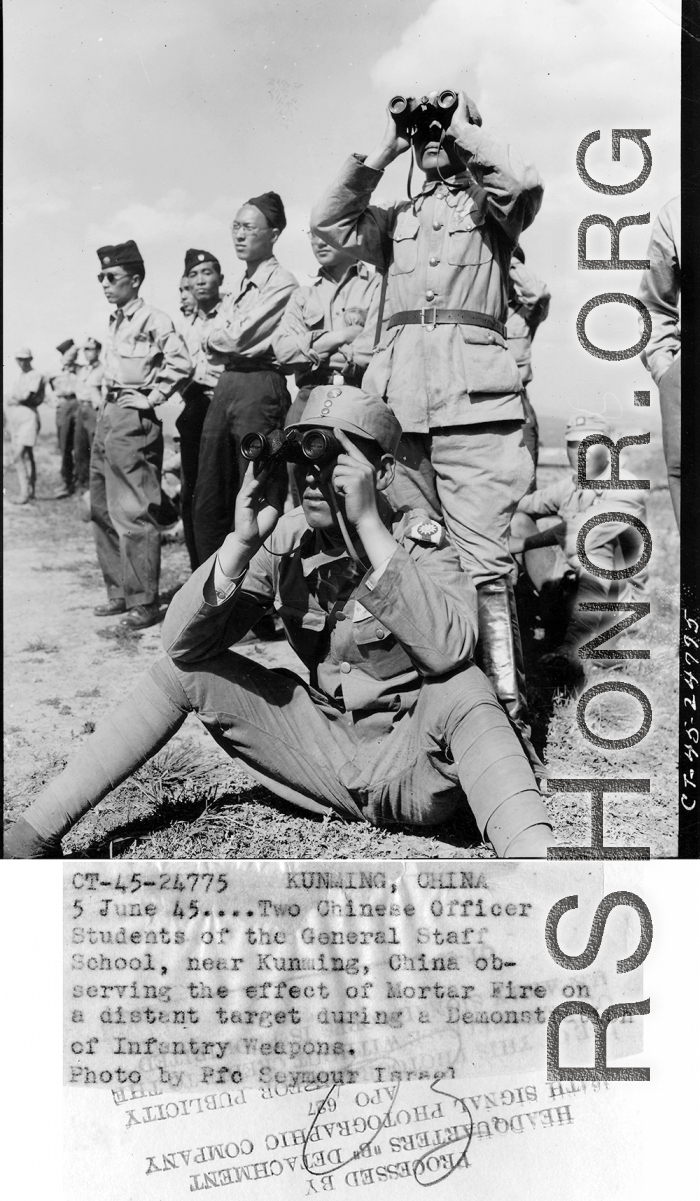 Two Chinese officer students of the General Staff School, near Kunming, China, observing the effect of mortar fire on distant target during a demonstration of infantry weapons.  June 5, 1945.  Photo by Pfc. Seymour Israel. 164th Signal Photographic Company, APO 627.