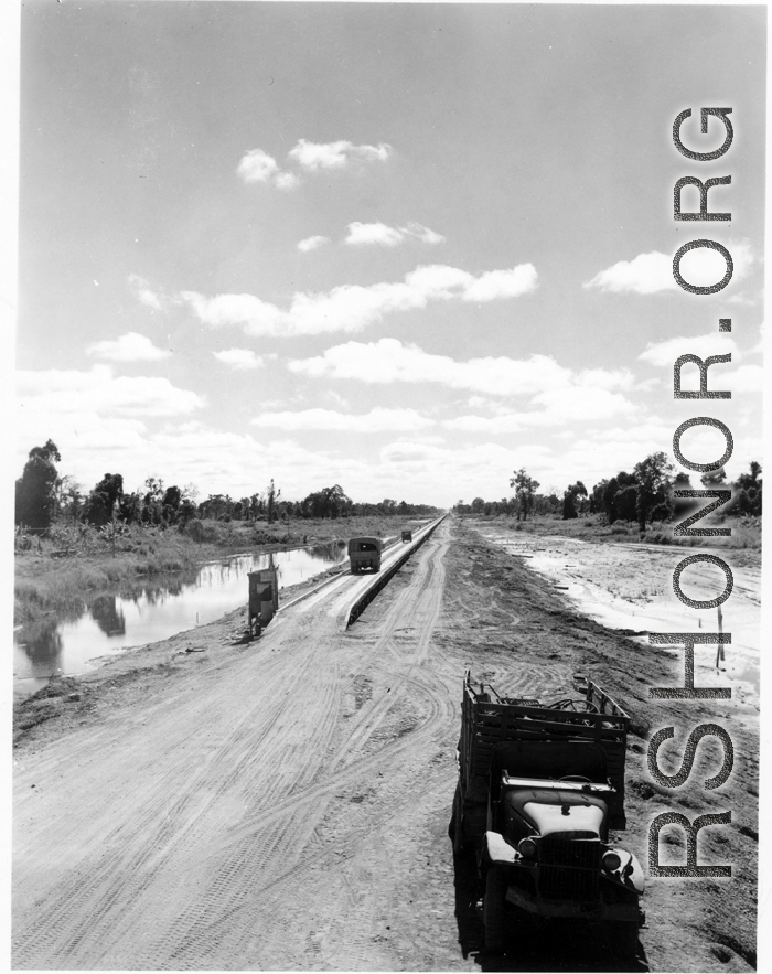 797th Engineer Forestry Company in Burma: Causeway through marsh on the Burma Road.  During WWII.
