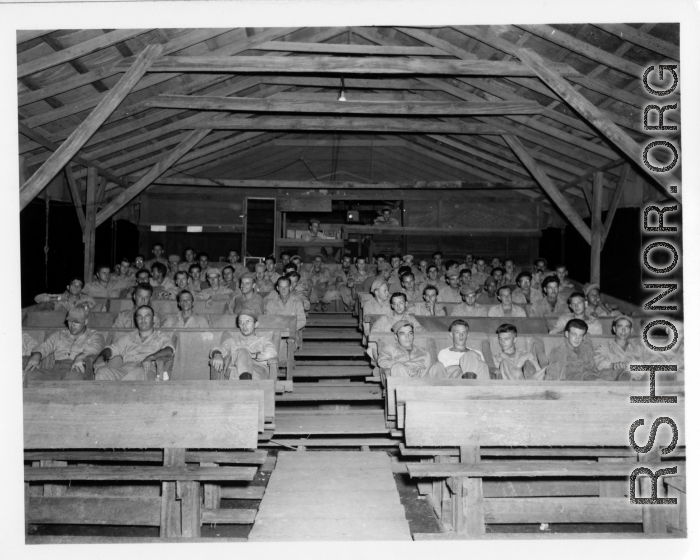 GIs of the 797th Engineer Forestry Company in Burma, watching a movie in the jungle.  During WWII.