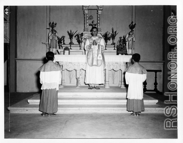 Services at a church in Burma. A western priest leads the ceremony.  In Burma near the 797th Engineer Forestry Company.  During WWII.