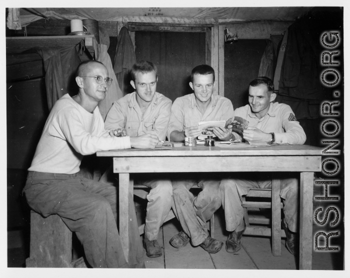 Engineers of the 797th Engineer Forestry Company pose in their barracks in Burma.  During WWII.