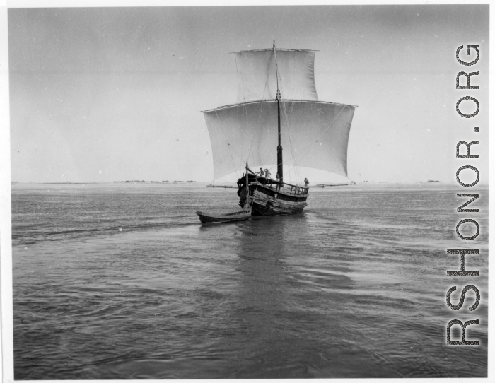 Boat with sails on a river in India.  Scenes in India witnessed by American GIs during WWII. For many Americans of that era, with their limited experience traveling, the everyday sights and sounds overseas were new, intriguing, and photo worthy.