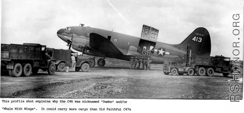 A C-46 Dumbo cargo airplane, #112413, on the ground, with cargo handlers, in the CBI.