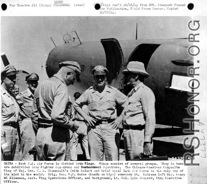 China-- Each U.S. Air Force is divided into Wings.  Wings consist of several groups.  They in terun are subdivided into Fighter Squadrons and Bombardment Squadrons.  The Chinese American Composite Wing (CACW) of Maj. Gen. C. L. Chennault's (with helmet and brief case) 14th Air Force is the only one of its kind in the world.  Brig. Gen. W.C. Morse (hands on hips) commands it.  Extreme left Maj. Henry Mc. Elleenan, Asst. Wing Operations Officer, and background, Lt. Col. Lyle Shepard, Wing Executive Officer.