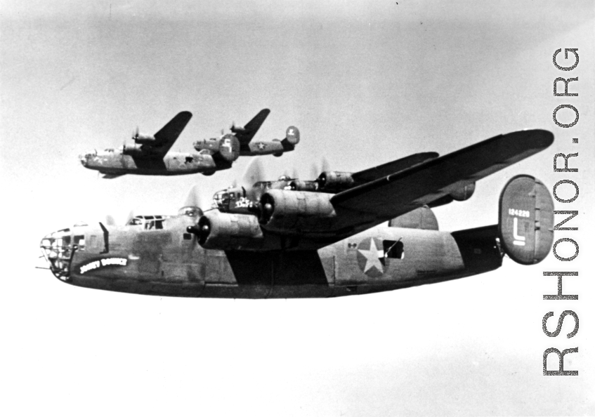 B-24s flying in a group. Possible tail-number of closest, nicknamed "Joney Bounce," is #124228. In the CBI.
