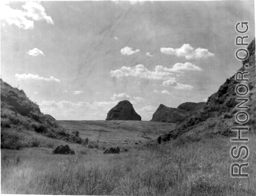 Grass hill between karst peaks in our around Liuzhou city, Guangxi province, China, in 1945.