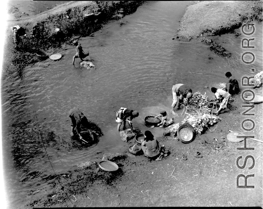 Local people wash vegetables and clothes in Yunnan province, China, during WWII.
