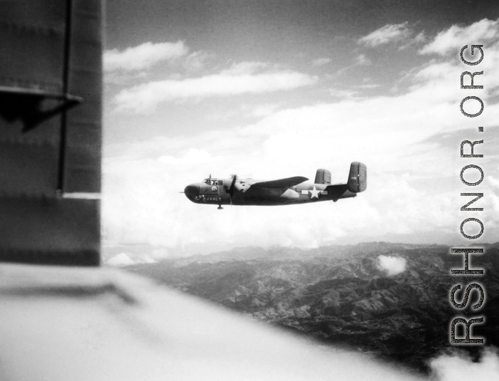 The B-25H "Rum Runner" from the 491st Bomb Squadron, the "RINGERS", flies in formation on a bombing mission during the Japanese "Ichigo" campaign. Sometime after this photo was taken Rum Runner, combat ID '439' was destroyed when they crashed landed near Liuzhou. No crewmen were seriously injured.