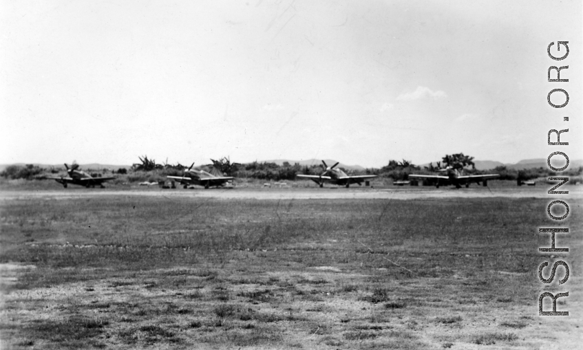 A row of P-51s in the CBI.  From the collection of Wozniak, combat photographer for the 491st Bomb Squadron, in the CBI.