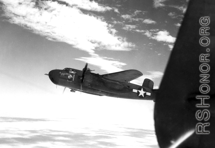 "Joyce Marie", a B-25H of the 491st Bomb Squadron, flies in formation somewhere in the CBI.  From the collection of Eugene Wozniak.