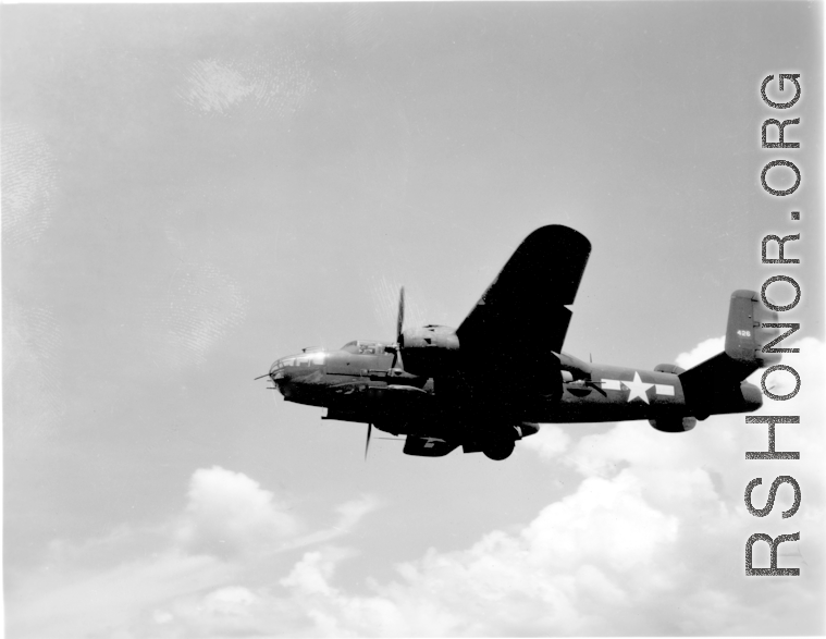 B-25 Mitchell bomber, tail number #426, takes off from an airstrip, possibly Yangkai (Yangjie) air strip in Yunnan province, China.