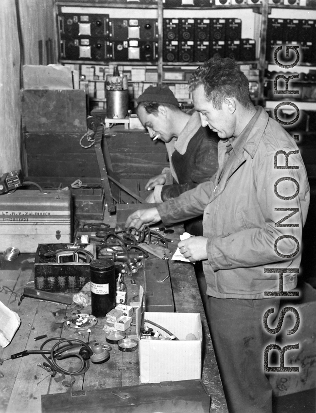 American GIs in the CBI at work on electronic gear during WWII.  Notice the case labeled to "Lt. R. V. Zalouder."