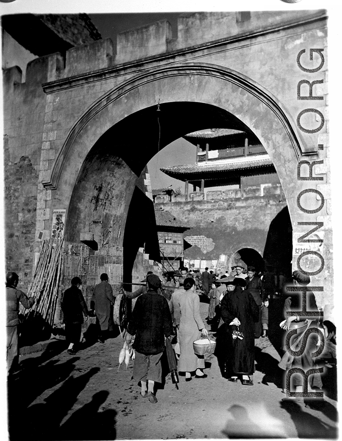 A busy town gate in Yunnan province, China, during WWII.  From the collection of Eugene T. Wozniak.