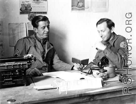 1st Sgt Roy S. Bierbauer, 491st Bomb Squadron, and S/Sgt Eugene T. Wozniak chat at the "Provost Sgt" desk in the orderly room, probably at Yangkai, China.   (Info courtesy Tony Strotman)