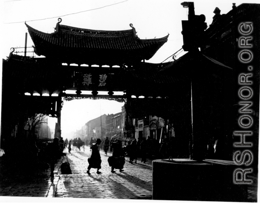 "Emerald Chicken Archway" 碧鸡坊 in Kunming during WWII.  Local people in Yunnan province, China, in Kunming city. In the CBI during WWII.
