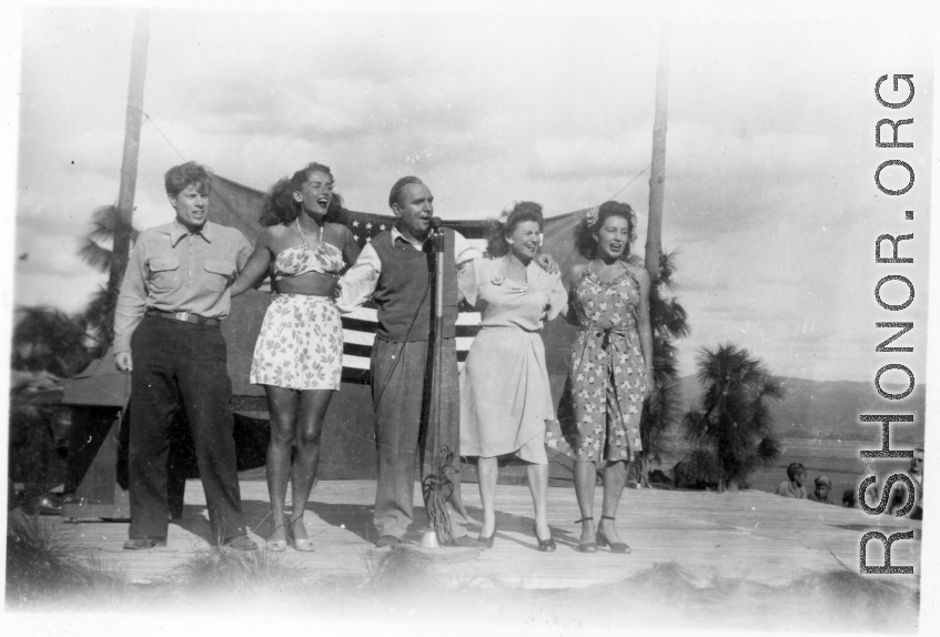 Pat O'Brien and his USO troupe perform at an American airbase in China in October 1944. Left to right they are Jimmy Dodd, Jinx Falkenberg, Pat O'Brien, Ruth Carrol and Betty Yeaton.  From the collection of Elmer Bukey.