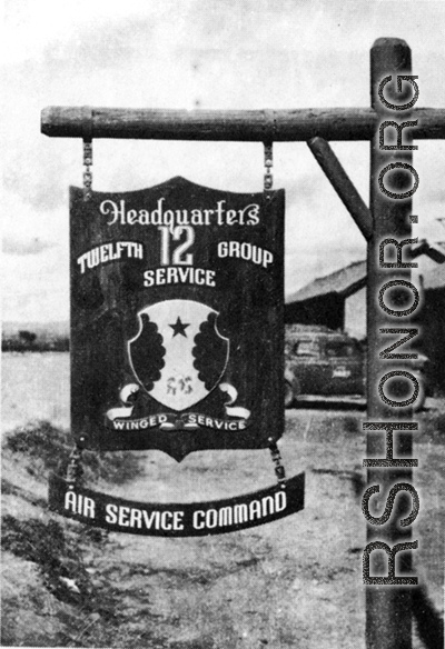 "Another Example Of Joe Goodman's Work. The 12th Air Service Group Emblem In Front Of Headquarters Building,Yang Tong Air Force Base, Kwelin (Guilin), China, 1944."