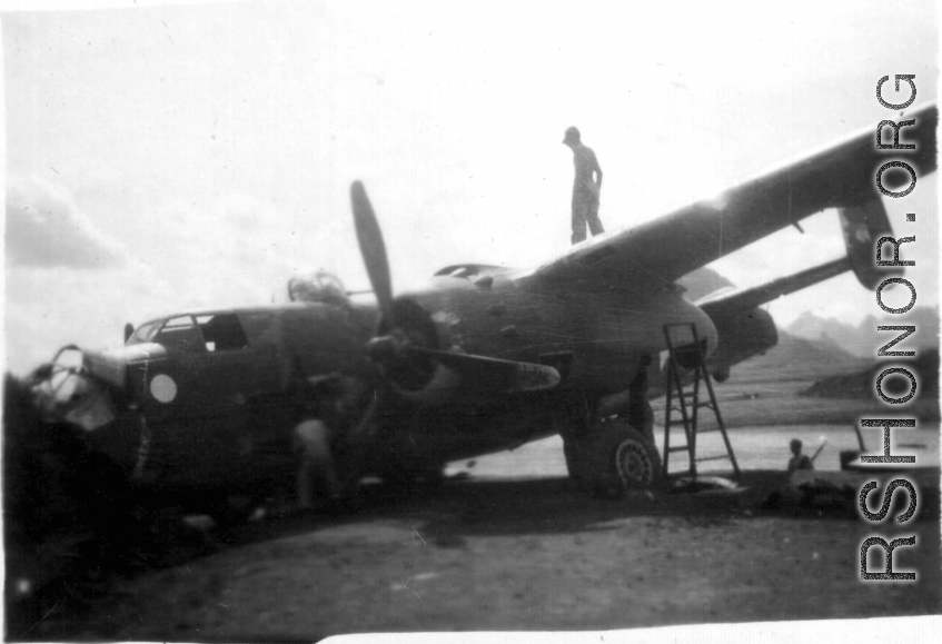 A B-25 after crashing in southern China, in Guangxi province, being salvaged.