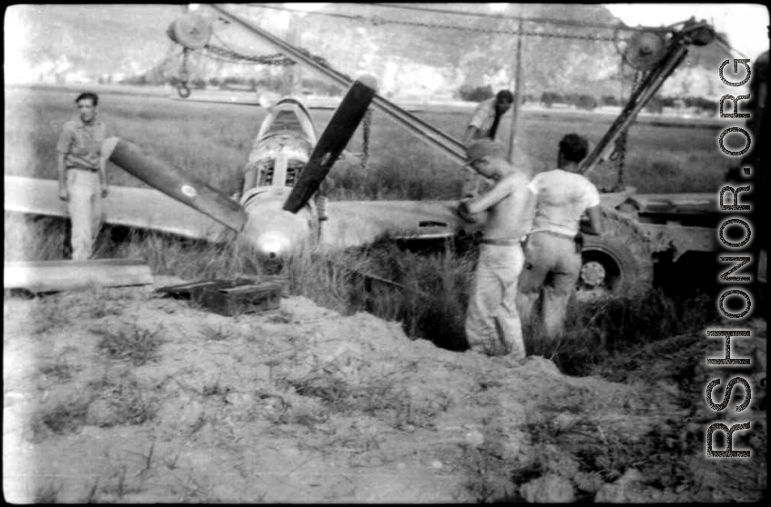 12th Air Service Group mechanics salvage a P-51 fighter in Guangxi, China, during WWII.
