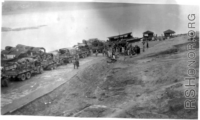 12th Air Service Group convoy waiting to cross barge in China during WWII.