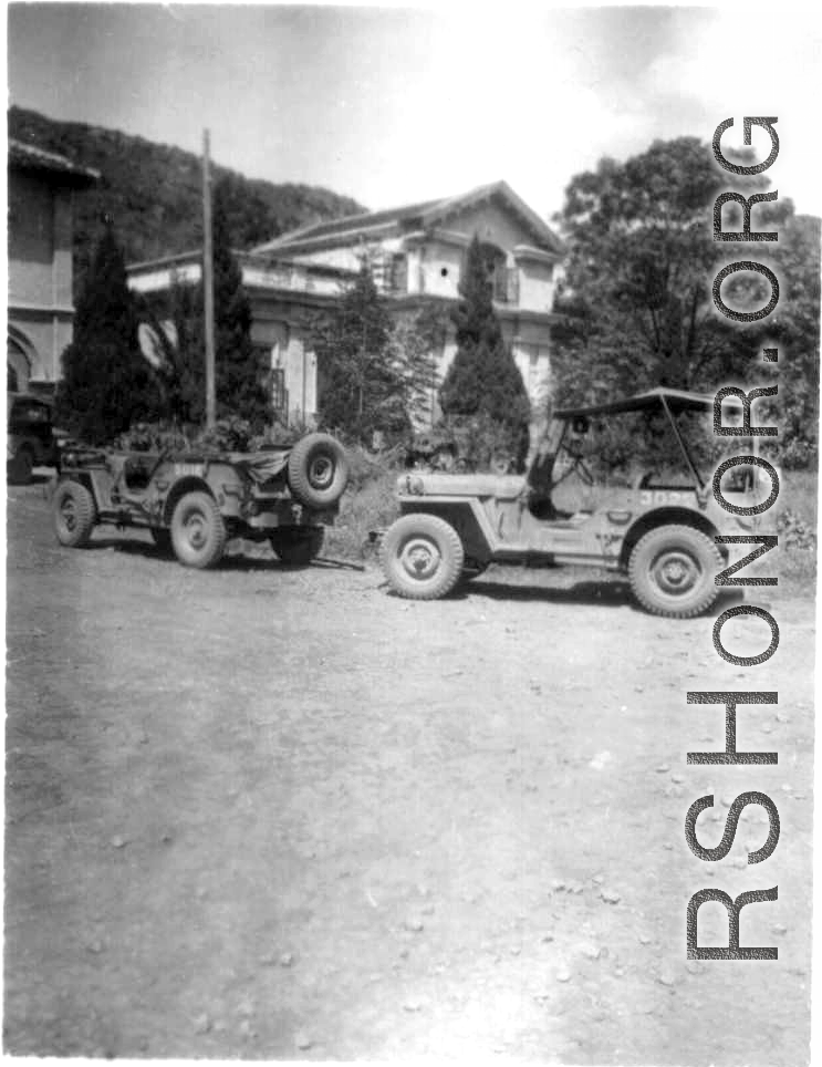 American jeeps parked in front of building used for some kind of military offices in Guangxi, China, during WWII.