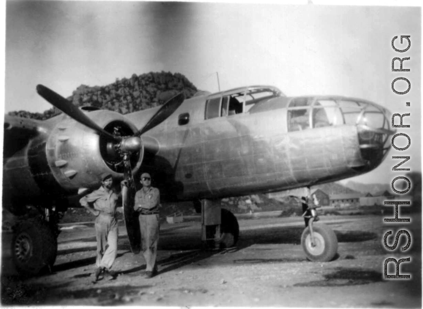 "Proud of Our Work On This Aircraft--Bukey and Miller pose for a photo in front of Casey Vincents B-25 The Silver Slipper at Kwelin [Guilin], China." Caption courtesy of Elmer Bukey.