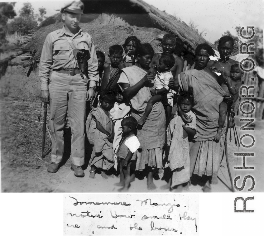 A GI with local people in India during WWII.    From the collection of David Firman, 61st Air Service Group.