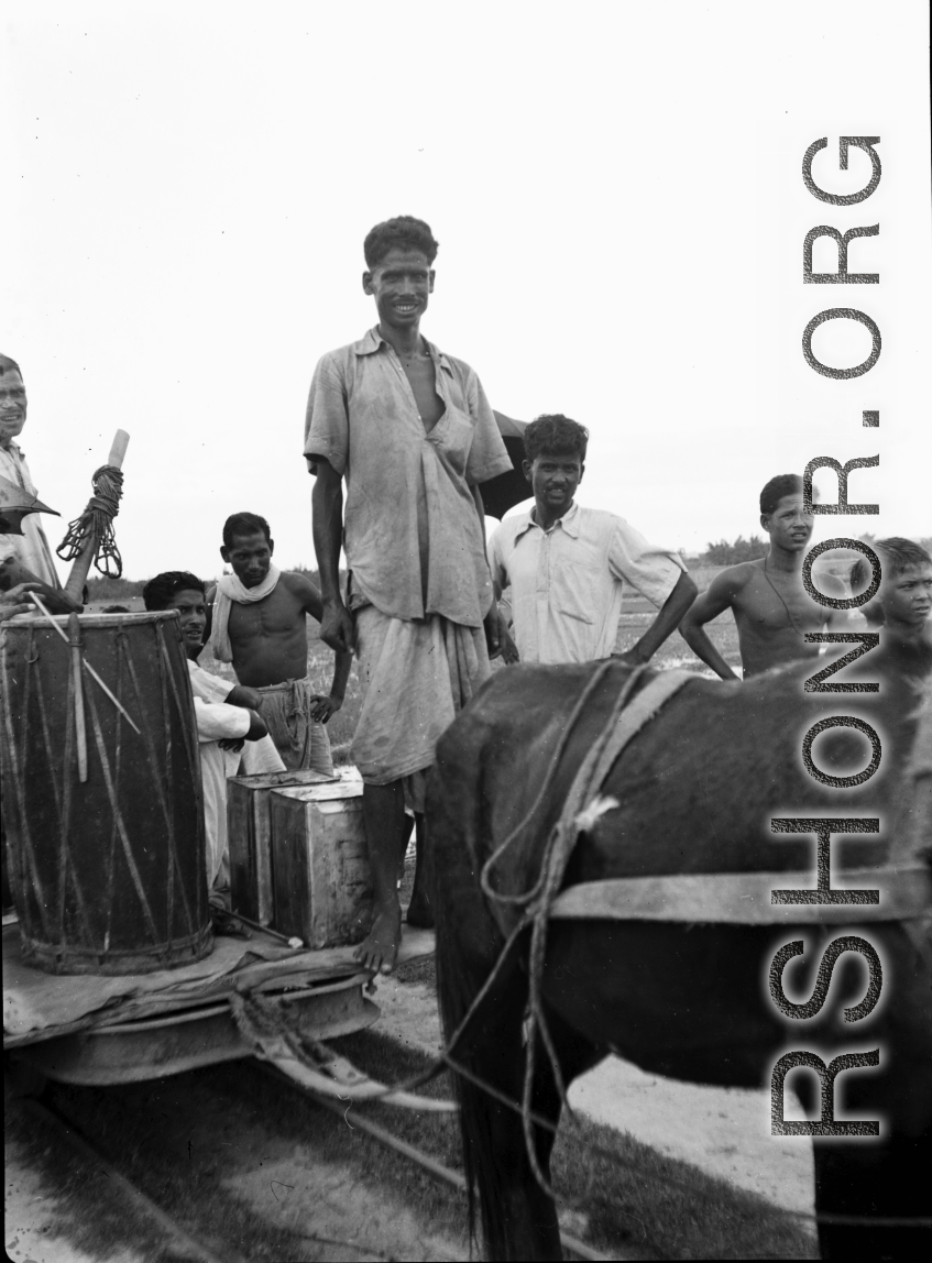 Local men with a mule-drawn train cart in India during WWII.    From the collection of David Firman, 61st Air Service Group.