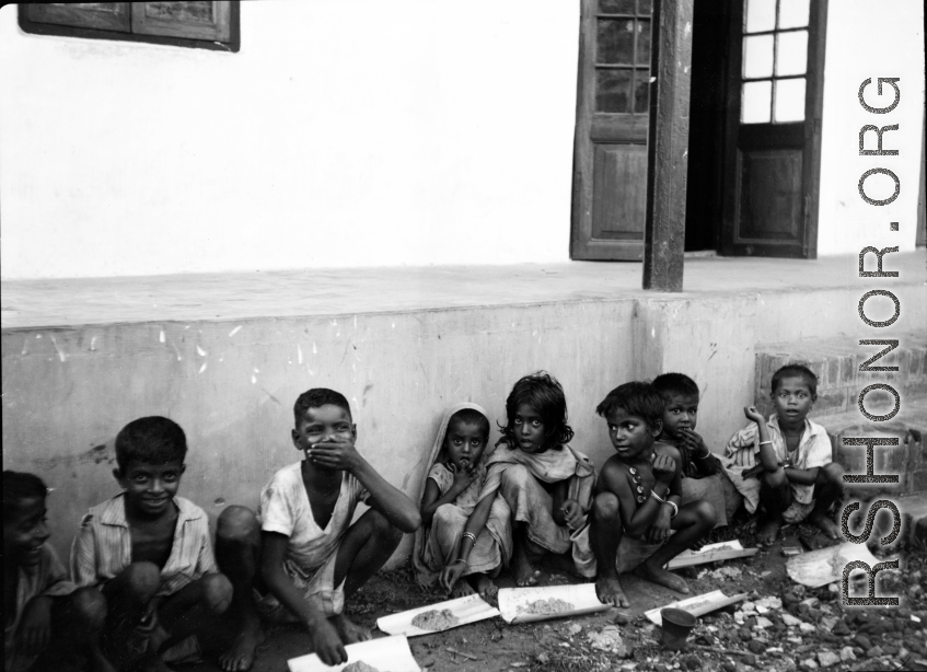 Local kids--with portions of food--in India during WWII.