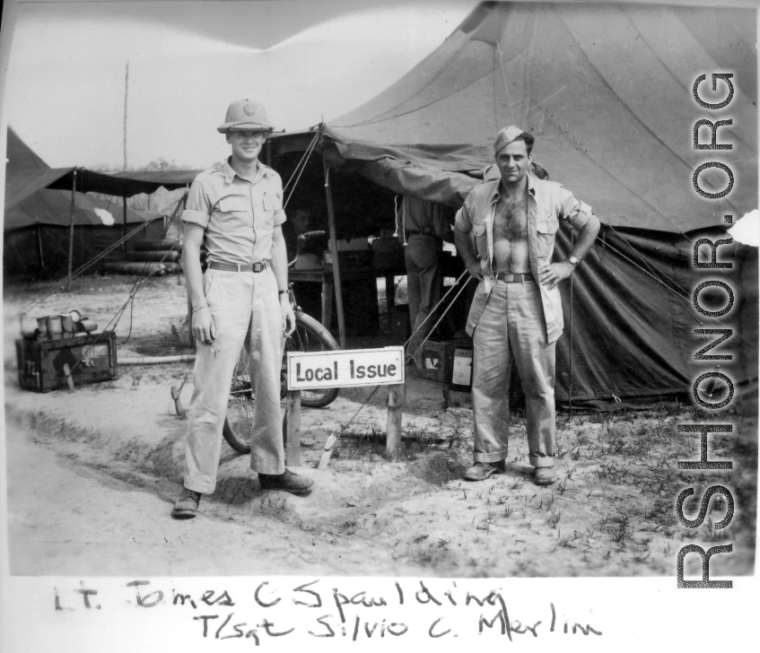 Lt. James C. Spaulding and T/Sgt Silvio C. Merlin pose in front of the "Local Issue" tent in India.    From the collection of David Firman, 61st Air Service Group.