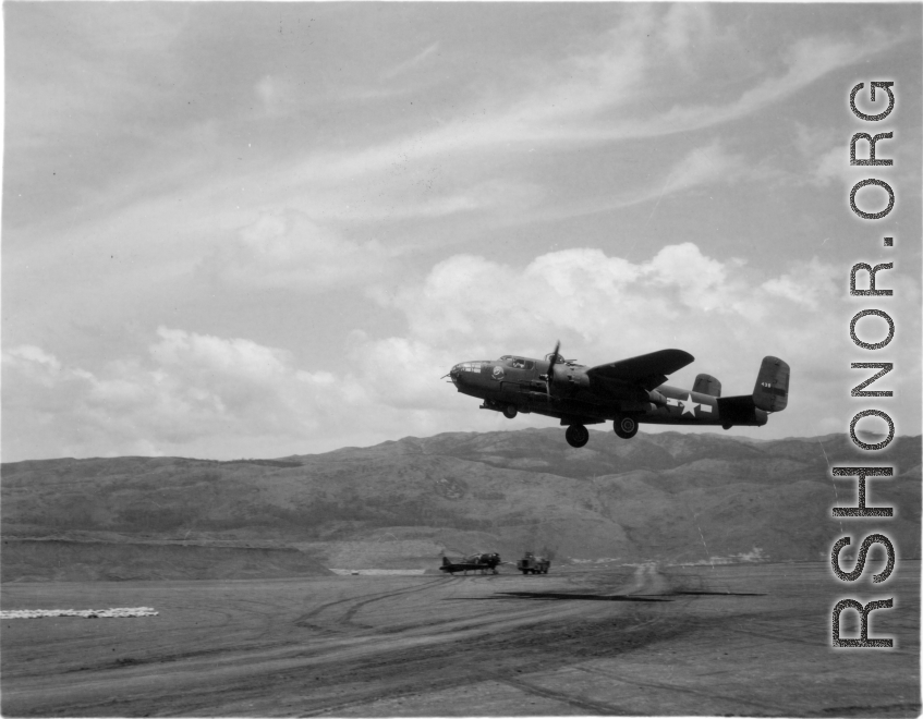 B-25 Mitchell bomber, #438, takes off from an airstrip, at Yangkai (Yangjie) air strip in Yunnan province, China.