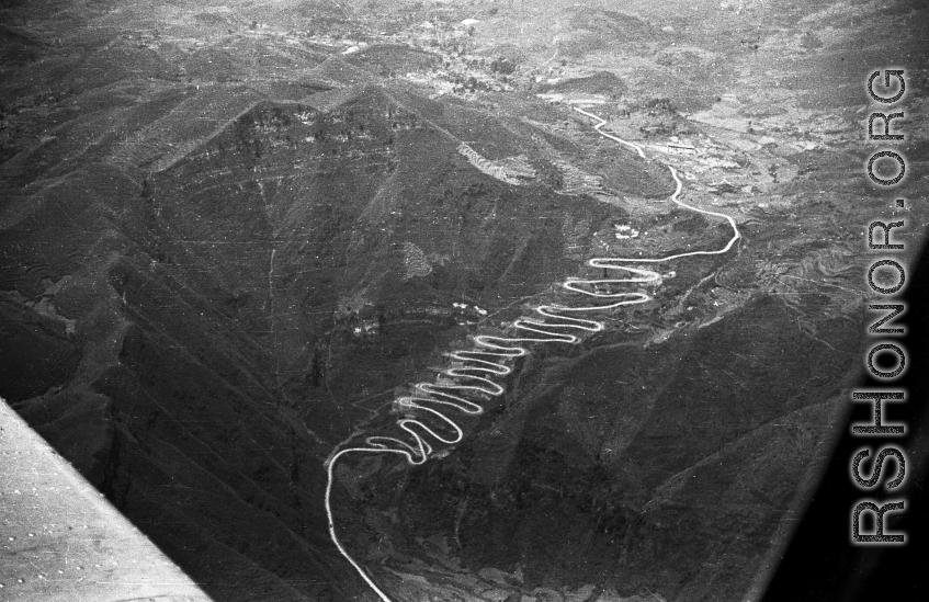 Aerial view of road in western Guizhou province, with famous multiple turns. During WWII.
