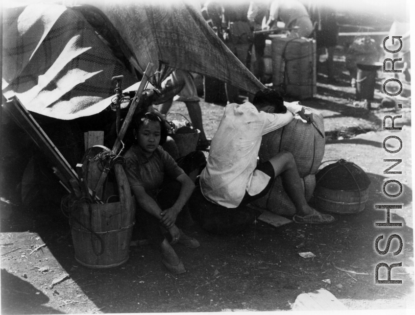 Exhausted and overheated Chinese refugees at the train station in Liuzhou during WWII, in the fall of 1944, as the Japanese advanced during the Ichigo campaign.
