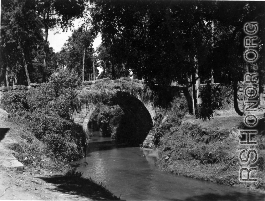 A small arched stone bridge near Kunming. During WWII.