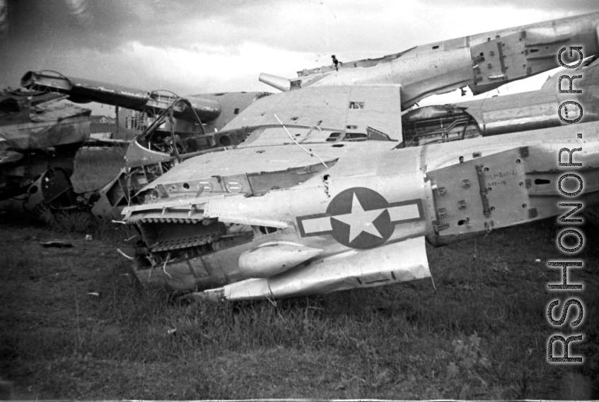 Wrecked American aircraft in the boneyard at the American airbase (including a P-38)--many of these were used as salvage for spare and repair parts for planes that were still flying.