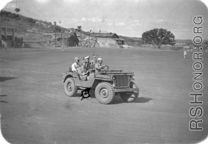 Chinese soldiers drive American jeep in northern China during WWII.