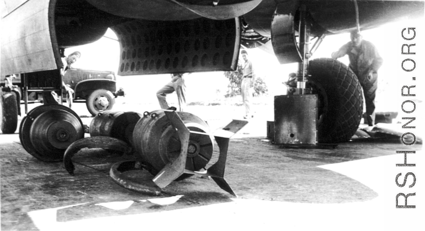 Large bombs being loaded onto a B-25 Mitchell bomber in China during WWII.  From the collection of Frank Bates.