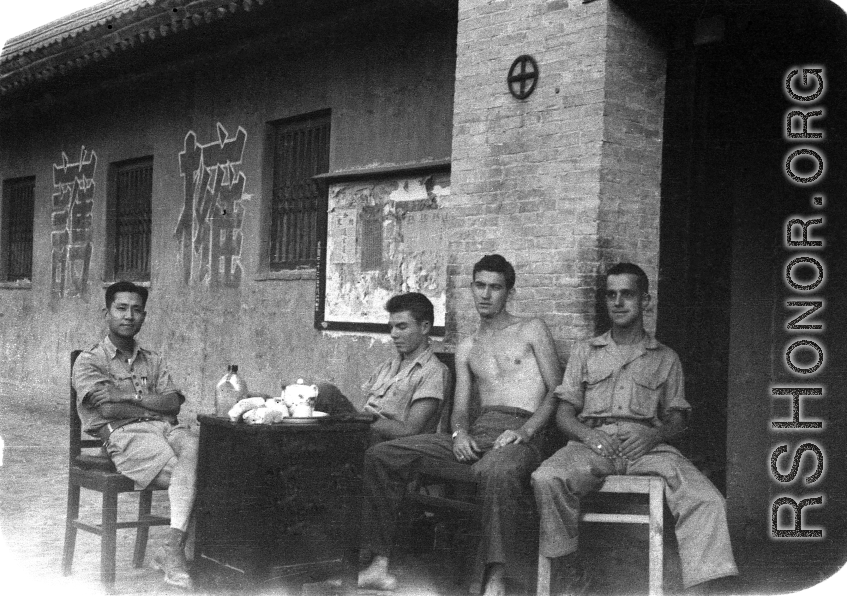 GI members of SACO and a Chinese soldier relax in northern China during WWII. 